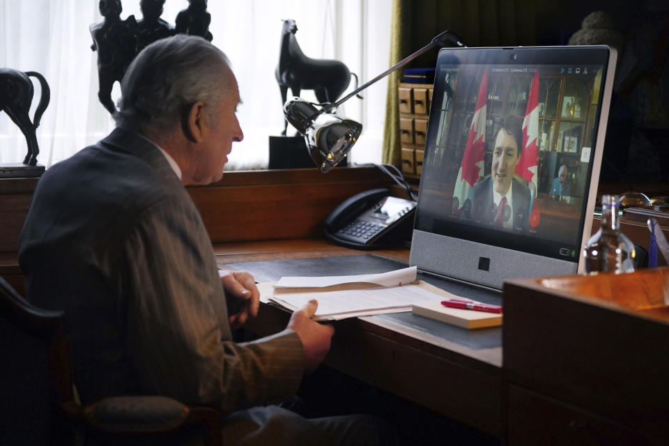 FILE - Britain's King Charles III speaks to Canadian Prime Minister Justin Trudeau via video link during a virtual audience, at Buckingham Palace, in London, March 6, 2024. Buckingham Palace says King Charles III will resume his public duties next week following treatment for cancer. The announcement on Friday April 26, 2024, comes almost three months after Charles took a break from public appearances to focus on his treatment for an undisclosed type of cancer. (Victoria Jones/Pool photo via AP, File)