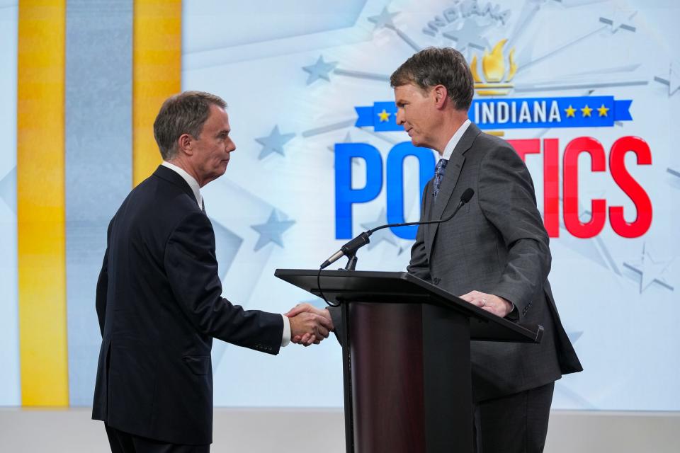 Mayor Joe Hogsett, left, shakes hands with Republican candidate Jefferson Shreve at the conclusion of the WISH-TV Indianapolis Mayoral Debate on Monday, Oct. 23, 2023, at the news station's studios in Indianapolis.