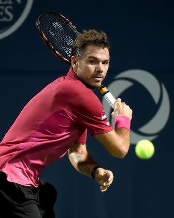 Jul 26, 2016; Toronto, Ontario, Canada; Stan Wawrinka of Switzerland hits a shot against Mikhail Youzhny of Russia on day two of the Rogers Cup tennis tournament at Aviva Centre. Mandatory Credit: Dan Hamilton-USA TODAY Sports