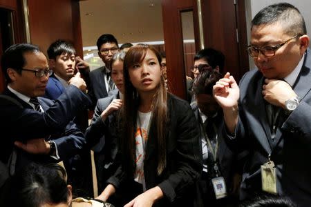 Newly elected pro-democracy lawmaker Yau Wai-ching is blocked by security guards from entering a meeting room at the Legislative Council in Hong Kong, China October 12, 2016. REUTERS/Bobby Yip