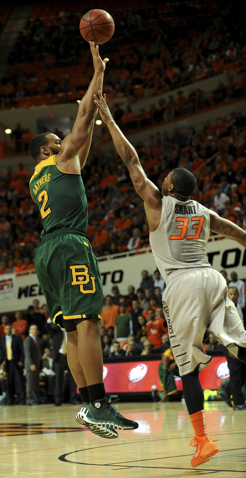 Baylor guard Rico Gathers (2) takes a shot over Oklahoma State guard Marcus Smart (33) during the first half of an NCAA college basketball game in Stillwater, Okla., Saturday, Feb. 1, 2014. Gathers scored 14 points in the 76-70 win over Oklahoma State. (AP Photo/Brody Schmidt)