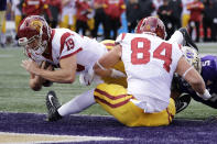 Southern Cal quarterback Matt Fink (19) scores on a three-yard carry against Washington in the first half of an NCAA college football game Saturday, Sept. 28, 2019, in Seattle. (AP Photo/Elaine Thompson)