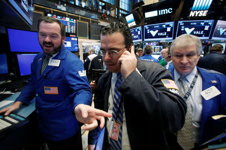 Traders work on the floor of the New York Stock Exchange (NYSE) in New York City, U.S., November 29, 2016. REUTERS/Brendan McDermid