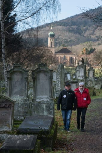 "You can't put a policeman in every cemetery," says Francis Laucher, walking with his wife in the Jewish cemetery in Jungholtz