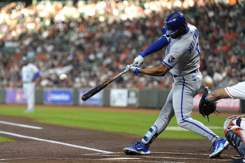 Kansas City Royals' MJ Melendez hits a sacrifice fly against the Houston Astros during the first inning of a baseball game Saturday, Sept. 23, 2023, in Houston. (AP Photo/David J. Phillip)