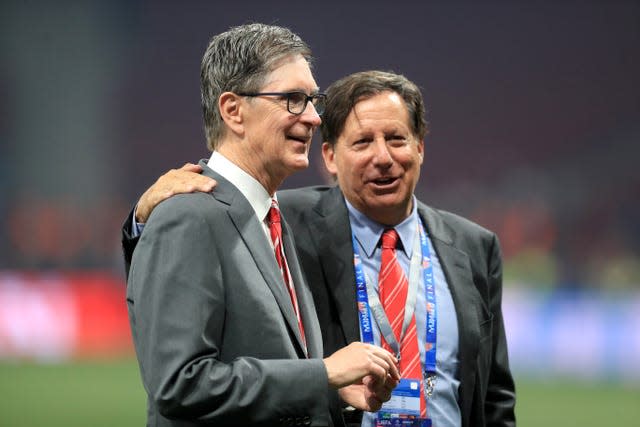 Liverpool owner John W. Henry (left) and chairman Tom Werner in conversation in a football stadium