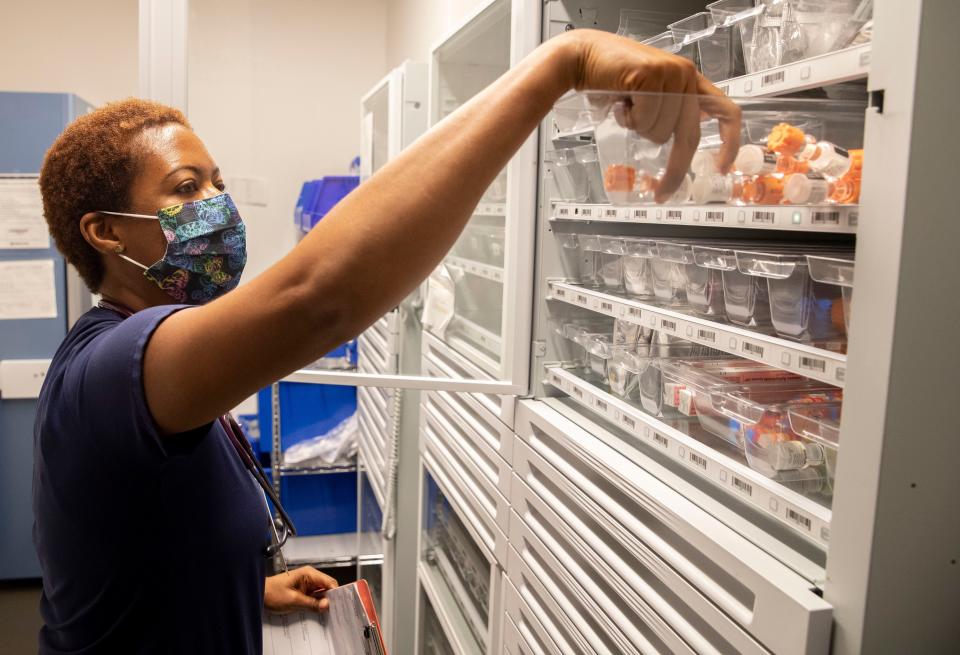 Transplant RN Auyana Smith gets medicine for a patient on Tuesday, June 7, 2022, at Methodist University Hospital in Memphis.