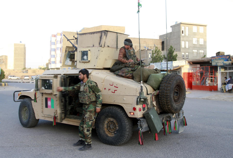 Afghan security personnel patrol after they took back control of parts of Herat city following fighting between Taliban and Afghan security forces in Herat province, west of Kabul, Afghanistan, Friday, Aug. 6, 2021. (AP Photo/Hamed Sarfarazi)