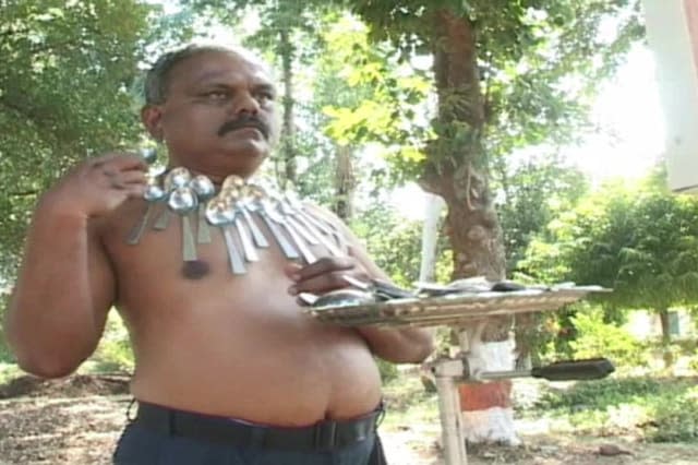 Incredible 'magnetic man' has unusual ability to attract metal objects to his body in central India