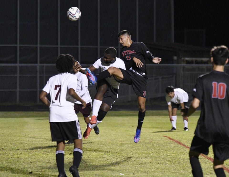 Palm Beach Central's Brandon Mejia wins possession amid multiple Palm Beach Lakes defenders during the first half of Friday's 8-0 Broncos victory.
