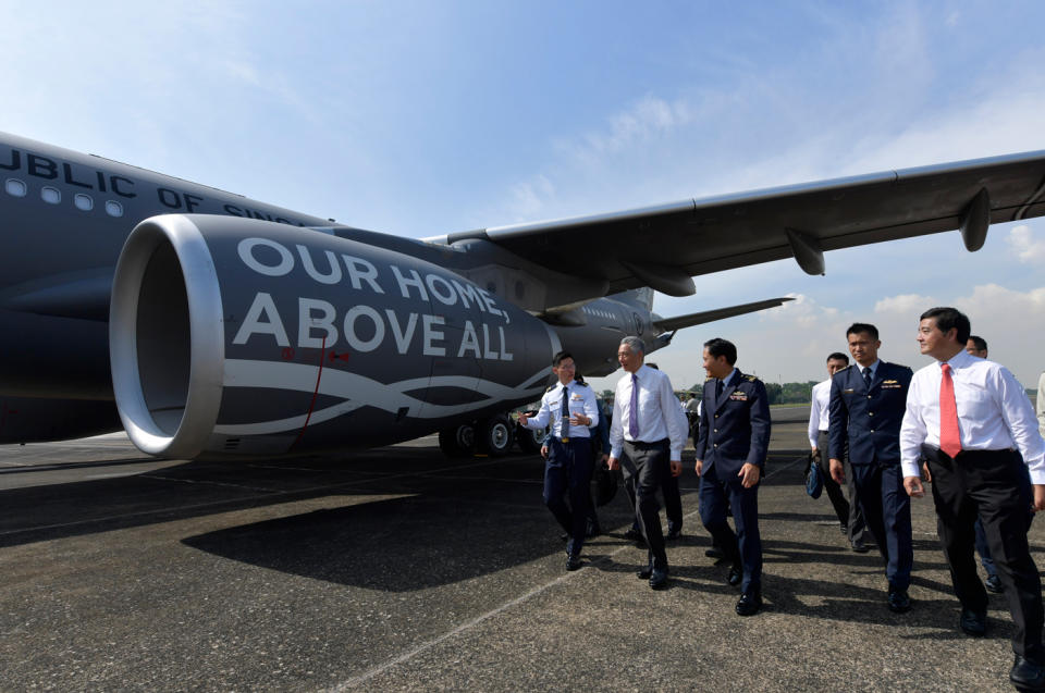 <p>PM Lee receiving a brief on the A330 Multi-Role Tanker Transport aircraft. (PHOTO: Mindef) </p>