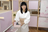 FILE- In this July 11, 2018, file photo, Japanese organizational expert Marie Kondo introduces her new line of storage boxes during a media event in New York. Kondo is sparking joy among shoppers feeling the urge to clean out their homes. But once you master the Japanese organizing expert’s novel approach to de-cluttering, what do you do with all the stuff you don’t want? (AP Photo/Seth Wenig, File)