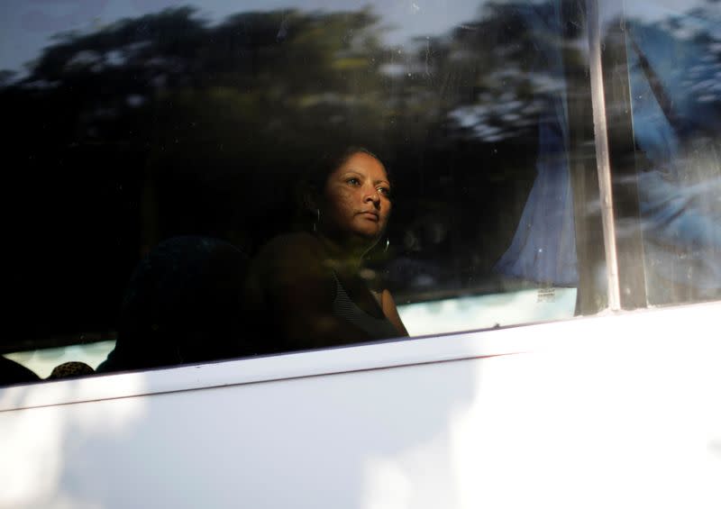 A migrant is seen in a bus near Frontera Hidalgo