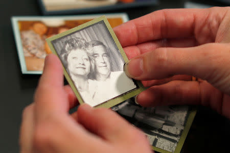 Crystal Deckard looks over an old photograph of her mother Darlene Coker and father Roy as she reminisces over her mother's life, in California, U.S. August 15, 2018. REUTERS/Mike Blake