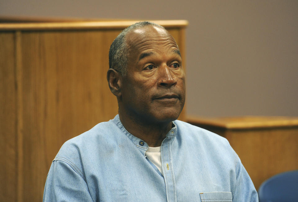 FILE - In this July 20, 2017 file photo, former NFL football star O.J. Simpson appears via video for his parole hearing at the Lovelock Correctional Center in Lovelock, Nev. Simpson has launched a Twitter account with a video post in which the former football star says he’s got a “little gettin’ even to do.” Simpson confirmed the new account to The Associated Press on Saturday, June 15, 2019. Simpson said in a phone interview it will be a lot of fun and that he had some things to straighten out. (Jason Bean/The Reno Gazette-Journal via AP, Pool, File)