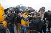 Journalists record activities aboard the USS Bonhomme Richard amphibious assault ship off the coast of Sydney, Australia, before a ceremony marking the start of Talisman Saber 2017, a biennial joint military exercise between the United States and Australia June 29, 2017. REUTERS/Jason Reed