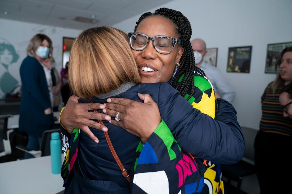 Detroit Free Press assistant editor Leah Olajide, left, hugs Nicole Avery Nichols after Nichols was named the Detroit Free Press top editor on Wednesday, May 3, 2023.