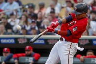 Minnesota Twins' Jorge Polanco hits a two-run home run against the Kansas City Royals during the first inning of a baseball game Friday, May 27, 2022, in Minneapolis. (AP Photo/Bruce Kluckhohn)