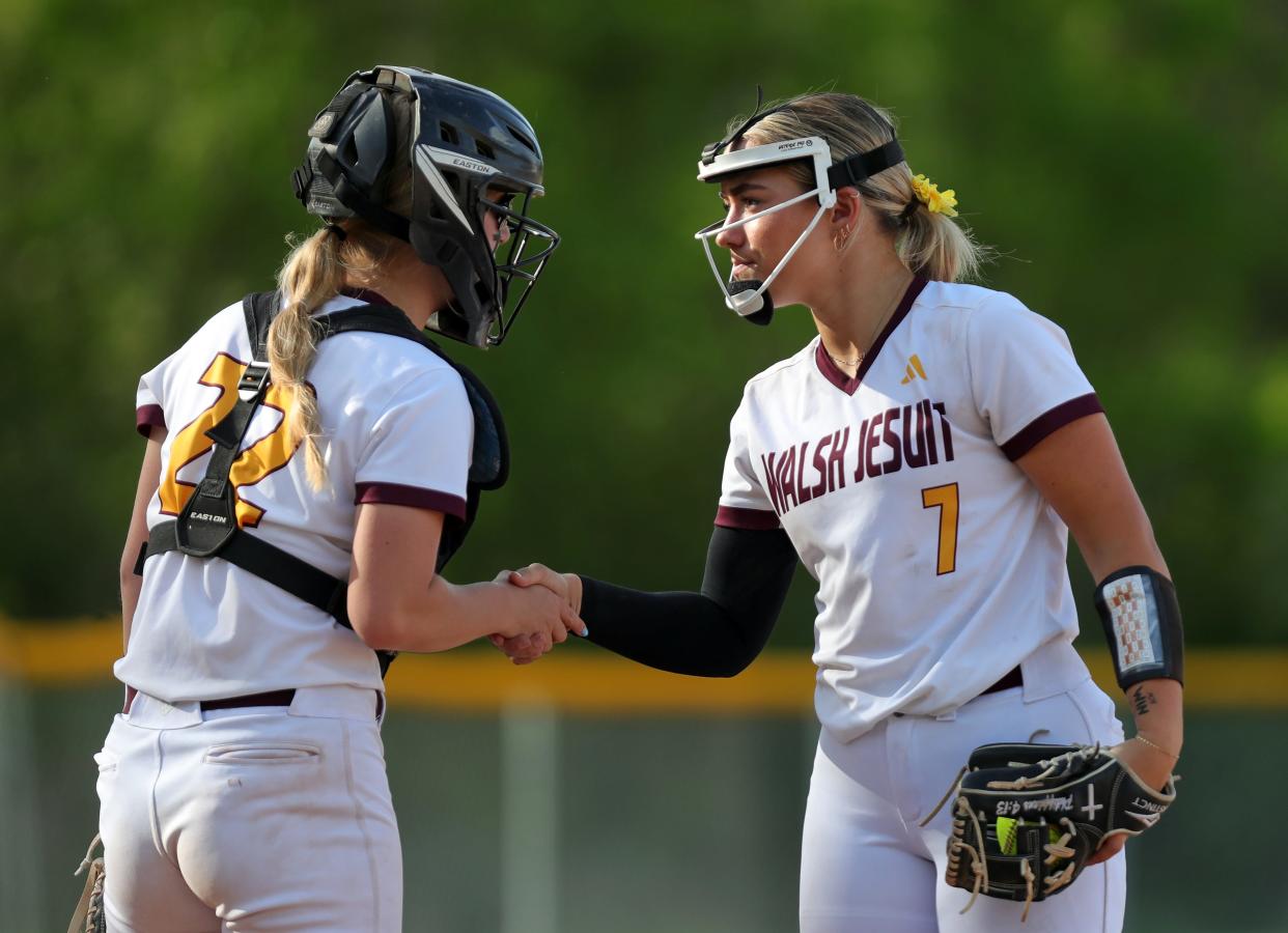 Walsh Jesuit pitcher Natalie Susa, right and catcher Caleigh Shaulis are two of the many outstanding individuals for the Warriors softball team this season.
