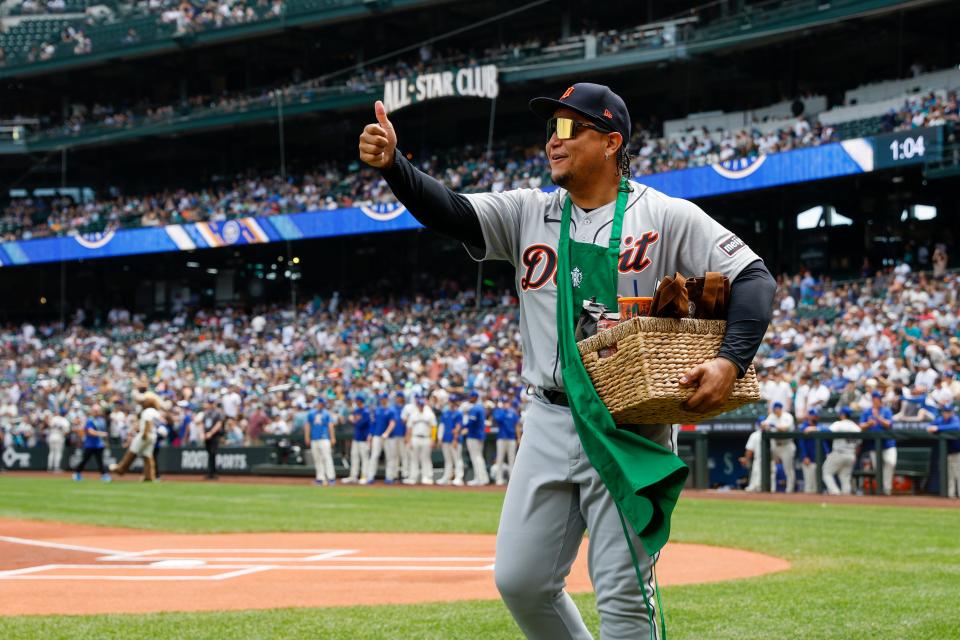 Detroit Tigers designated hitter Miguel Cabrera gives a thumbs up after receiving a Starbucks apron and gift basket for making his final appearance at T-Mobile Park before a game against the Seattle Mariners on Sunday, July 16, 2023.