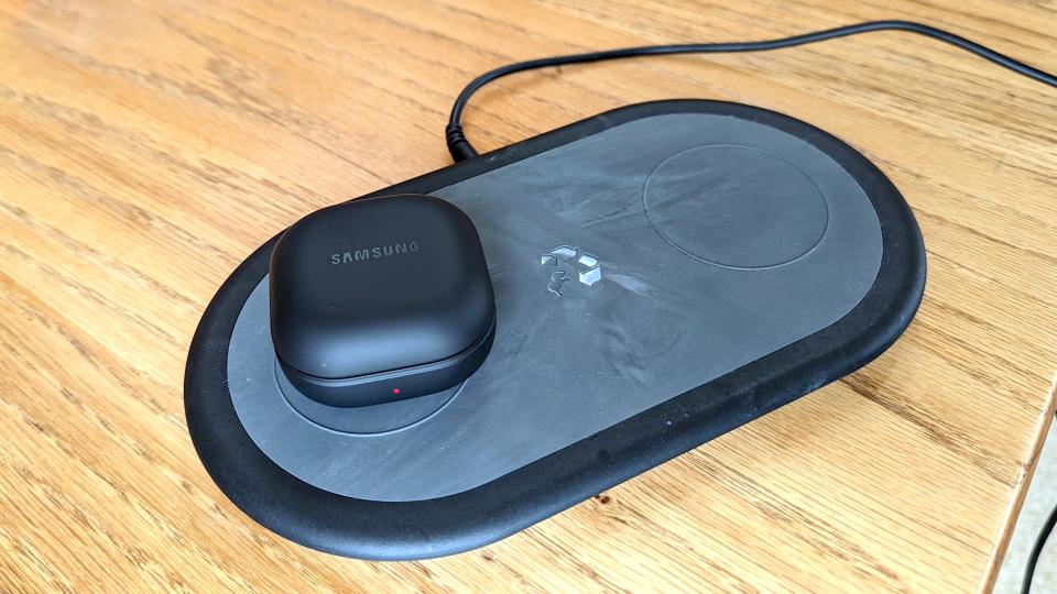 The Samsung Galaxy Buds 2 Pro's charging case being wireless charged on a Qi-enabled charging pad