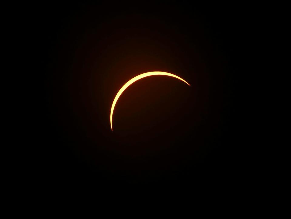 The 2017 solar eclipse as seen above Churchill Downs during peak coverage in Louisville, KY.