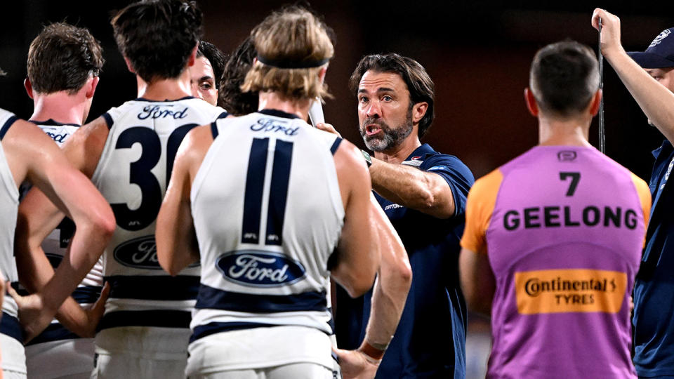 Geelong coach Chris Scott speaks to his players.