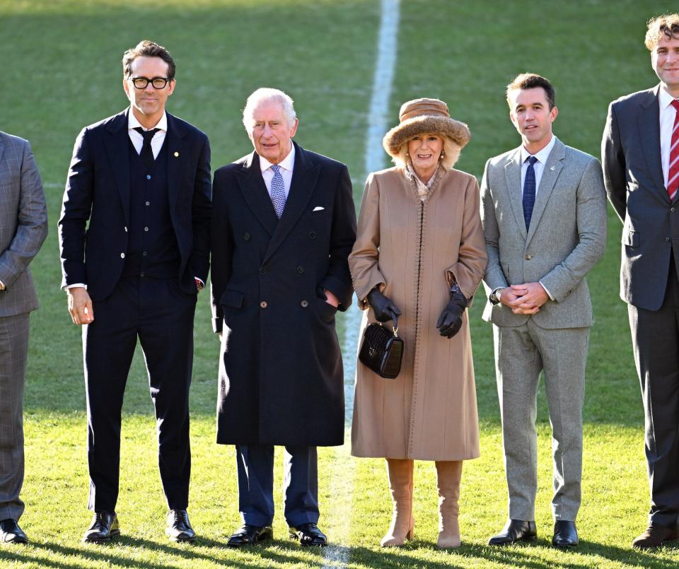 King Charles III and Camilla, Queen Consort meet with Co-Owners of Wrexham AFC, Ryan Reynolds and Rob McElhenney on December 9, 2022.