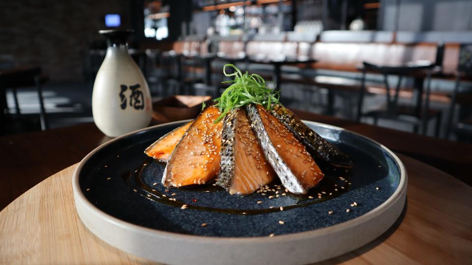 Teriyaki salmon is among the items on the menu at East Izakaya; the menus vary slightly from location to location.