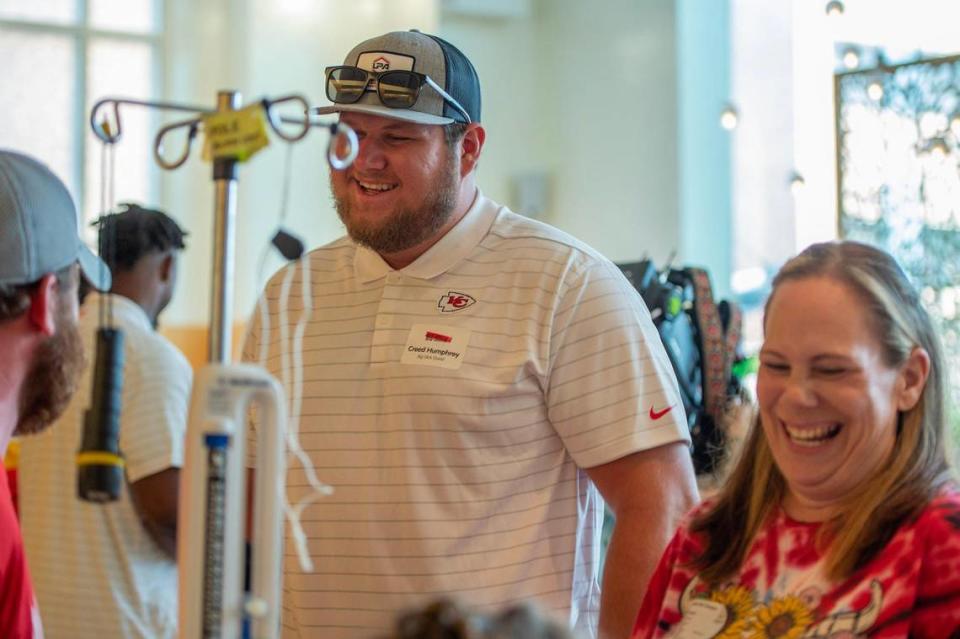 Kansas City Chiefs center Creed Humphrey speaks with parents after a magic show at Children’s Mercy Hospital on Thursday.