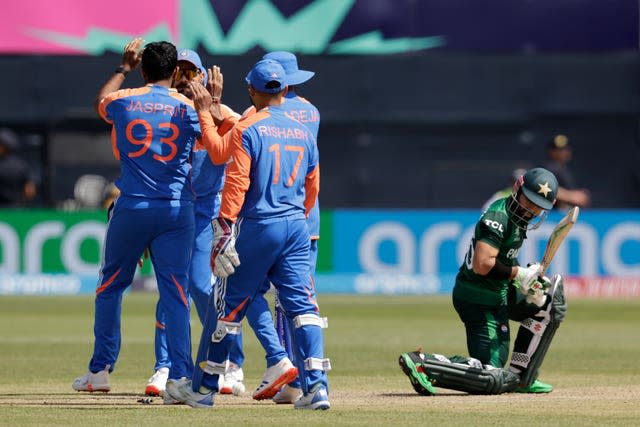 India celebrate a wicket with high fives