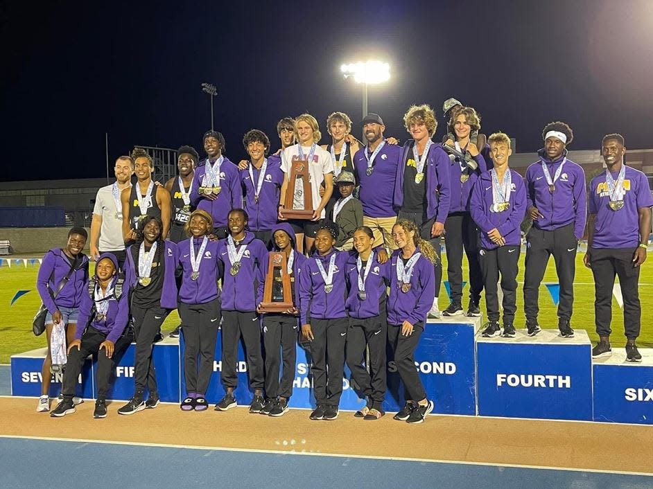 The Montverde Academy boys and girls track-and-field teams celebrate following platform finishes at the FHSAA state championships recently at the University of Florida. The Eagles' boys team won the Class 2A team title and the girls team finished second.