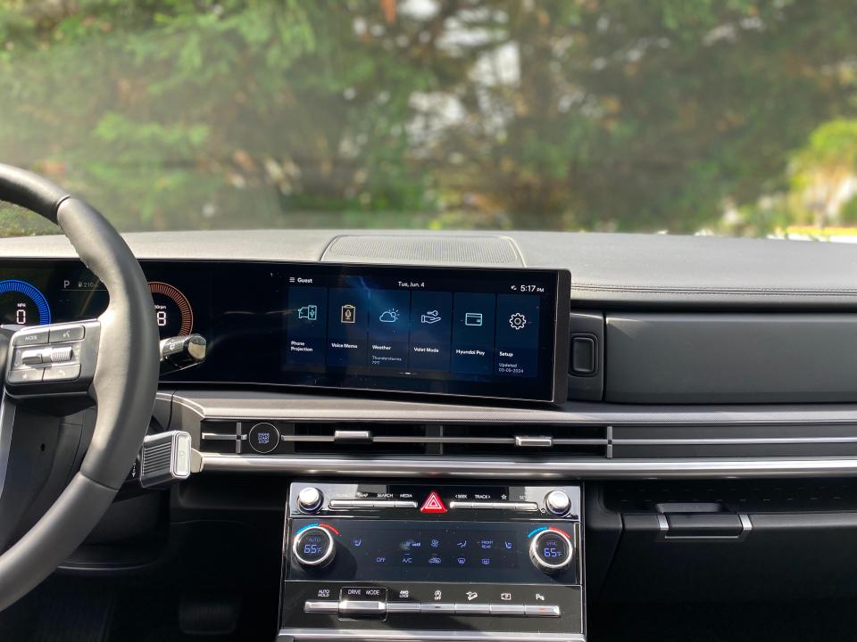 The front dash and center console of a 2024 Hyundai Santa Fe SUV.