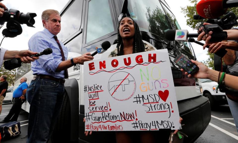 Tyra Hemans, a senior at Marjory Stoneman Douglas high school, speaks before boarding busses with other students to travel to Tallahassee, the state capital. 