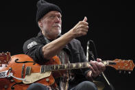 Canadian rock legend Randy Bachman poses with his reunited Gretsch guitar, which was stolen in 1977, during the Lost and Found Guitar Exchange Ceremony Friday, July 1, 2022, at Canadian Embassy in Tokyo. Bachman’s long-held dream came true Friday when he was reunited in Tokyo with a beloved guitar nearly a half-century after it was stolen from a Toronto hotel. Bachman, 78, a former member of The Guess Who, received the guitar from a Japanese musician who had bought it at a Tokyo store in 2014 without knowing its history. (AP Photo/Eugene Hoshiko)