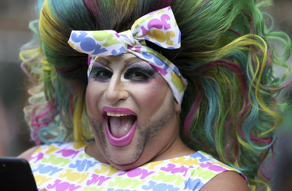 A participant smiles as he prepares for the annual Gay and Lesbian Mardi Gras in Sydney, Saturday, March 2, 2019. The 41st parade features almost 200 floats. (AP Photo/Rick Rycroft)