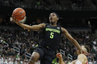 Michigan State guard Cassius Winston (5) makes a layup during the second half of an NCAA college basketball game against Wisconsin, Friday, Jan. 17, 2020, in East Lansing, Mich. (AP Photo/Carlos Osorio)