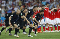 <p>Croatia players celebrate their penalty shoot-out win as their opponents watch on </p>