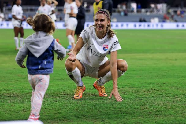 PHOTO: San Diego Wave FC forward Alex Morgan is greeted by her daughter Charlie Carrasco after the game against the Racing Louisville FC at Lynn Family Stadium, May 18, 2022, in Louisville, Ky.  (Aaron Doster/USA TODAY Sports)