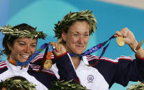 Kerri Walsh (R) and Misty May of United States celebrate as they receive their gold medals during the women's Beach Volleyball medal ceremony on August 24, 2004 during the Athens 2004 Summer Olympic Games at the Olympic Beach Volleyball Centre at the Faliro Coastal Zone Complex in Athens, Greece.