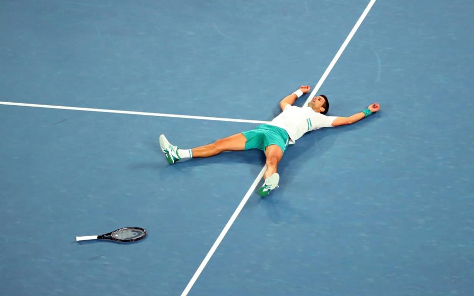 Serbia's Novak Djokovic celebrates winning his final match against Russia's Daniil Medvedev - Reuters