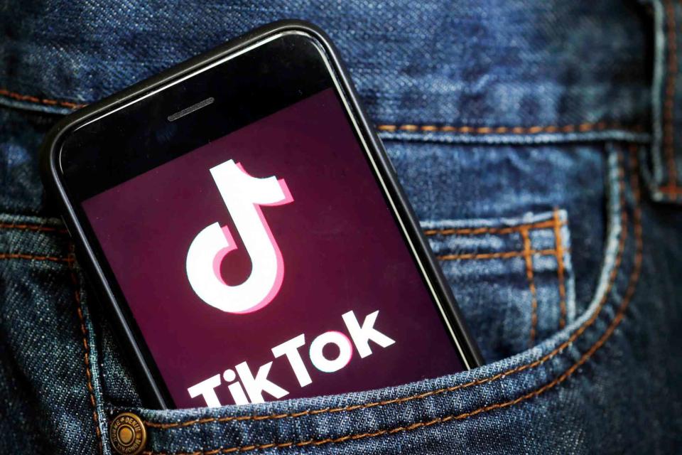 tik tok on mobile phone in pocket