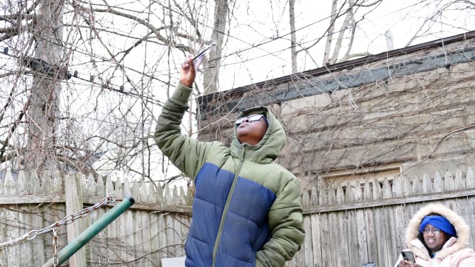 Josiah Tapp, 12, of Rochester gathered temperature data and cloud cover information during the Monday, April 8, total solar eclipse in Rochester.