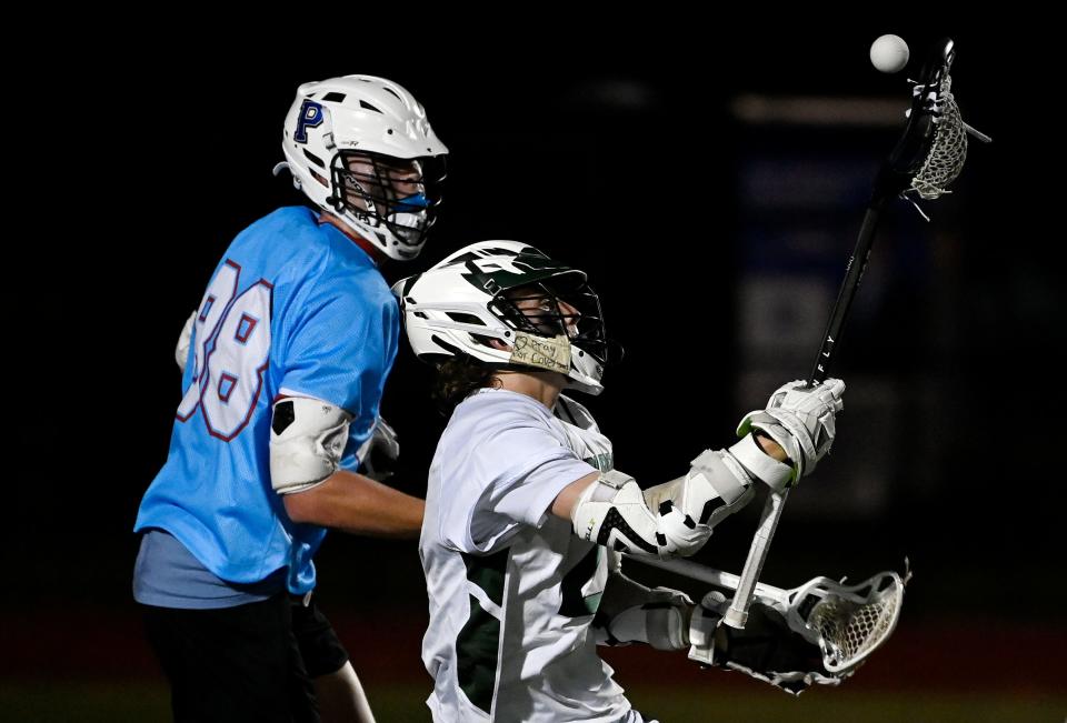 Hillsboro’s Matthew Teller, left, gets control of the ball as Page’s Hudson Powell (88) defends during first half of an TSLA Division I A lacrosse state championship game Saturday, May 18, 2024 in Nolensville, Tenn.