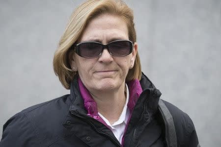 Joann Crupi, former portfolio manager for Bernard L. Madoff Investment Securities LLC, exits the Manhattan Federal Court house in New York, March 24, 2014. REUTERS/Brendan McDermid/Files