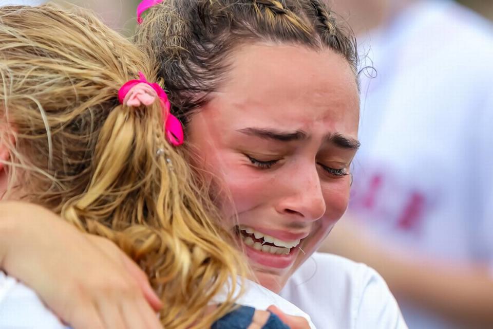 Charlotte Latin Natalie Massardo is overwhelmed with emotion after her team won the NCISAA girls lacrosse championship at Charlotte Country Day