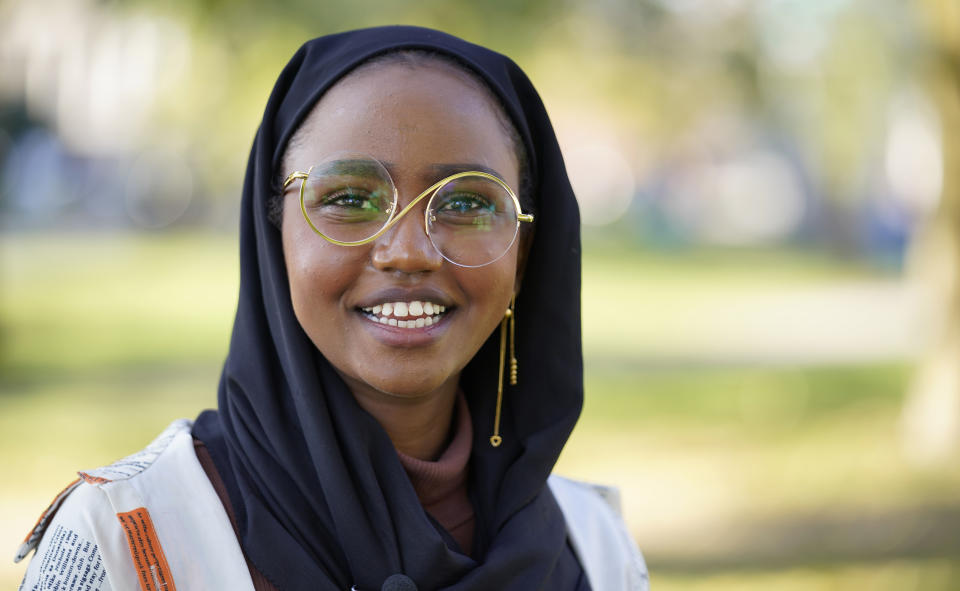 Mana Abdi, 26, a Democratic candidate for state legislature, speaks with a reporter, Thursday, Oct. 6, 2022, in Lewiston, Maine. She is running unopposed. Her Republican opponent, who had posted on Facebook that Muslims "should not be allowed to hold public office," withdrew from the race in August. (AP Photo/Robert F. Bukaty)