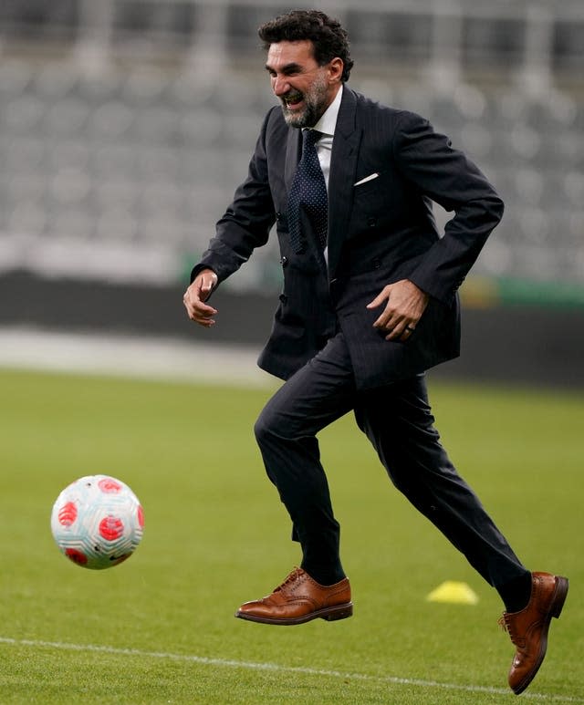 Newcastle chairman Yasir Al Rumayyan plays on the pitch at St. James' Park