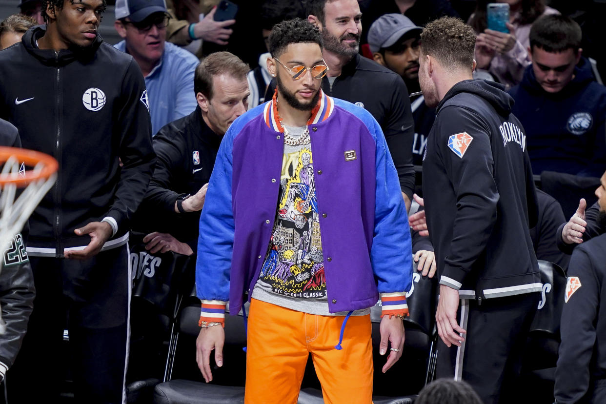 Brooklyn Nets' Ben Simmons stands by the bench during the first half of Game 3 of an NBA basketball first-round playoff series against the Boston Celtics, Saturday, April 23, 2022, in New York. (AP Photo/John Minchillo)