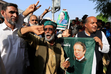 A supporter of former Prime Minister Nawaz Sharif reacts as he celebrate with others following the court's decision in Islamabad, Pakistan September 19, 2018. REUTERS/Faisal Mahmood
